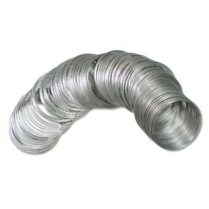 May include: A large stack of silver metal rings, stacked in a curved shape.