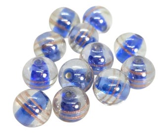 Cuentas de vidrio redondas: 10-12 mm, transparentes con centro azul oscuro y rayas doradas, 12 unidades.