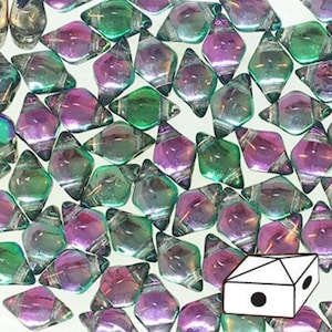 May include: A close-up of a collection of iridescent glass beads in shades of green and purple. The beads are shaped like diamonds and have a metallic sheen.