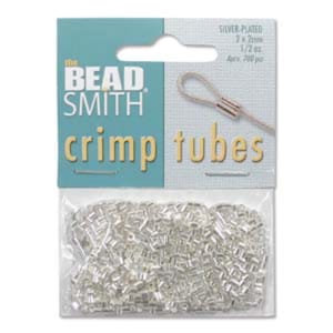 May include: Silver-plated crimp tubes from The Bead Smith, packaged in a clear plastic bag. The package includes the text "crimp tubes" in gold lettering. The package also includes the text "Silver Plated 2 x 2mm 1/2 oz. Aprx. 700 pcs."