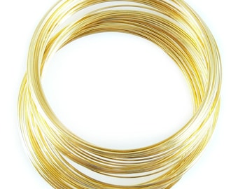May include: A coil of gold-colored wire, perfect for jewelry making or crafting projects.