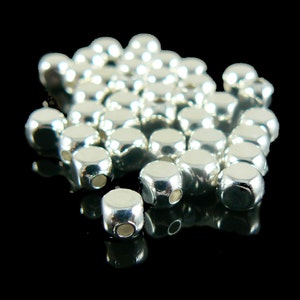 Metal beads: 5 mm x 4 mm rounded cube, silver plated metal, 72 beads