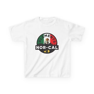 May include: White t-shirt featuring a circular graphic with the text "ELEMENTS" and "NOR-CAL". The graphic includes a Mexican flag design, a cityscape silhouette, and a yellow van illustration.
