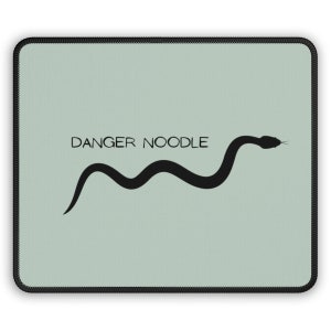 May include: A light green mouse pad with a black snake silhouette and the text "DANGER NOODLE" in black.