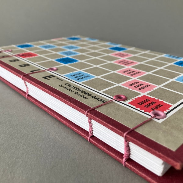 Upcycled handbound journal with covers from an old game board