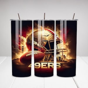 May include: Three black and gold stainless steel tumblers with a football helmet and football design. The tumblers feature a red and gold helmet with the text "49ers" on the bottom.