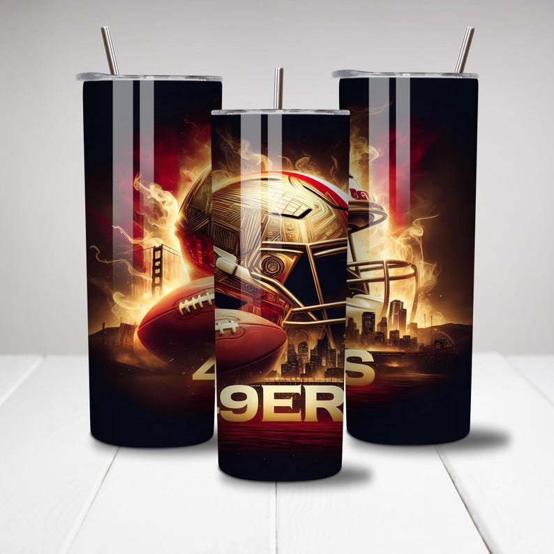 May include: Three black stainless steel tumblers with a gold football helmet and a football in front of a fiery background. The text "49ERS" is visible on the tumbler in the center.