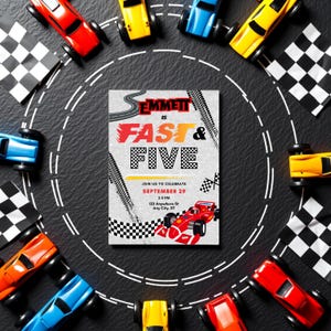 May include: A birthday party invitation with a race car theme. The invitation reads "Emmett is Fast & Five" and includes the date, time, and location. Toy race cars in various colors surround the invitation, along with checkered flags.