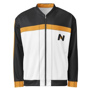 May include: A black, white, and orange zip-up jacket. The jacket has a black upper section and sleeves, with an orange stripe across the chest. The front is white with vertical black stripes and a black "N" logo. The jacket has a full zipper.