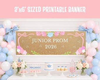 May include: A brown banner with the text "JUNIOR PROM 2026" is decorated with pink and blue floral accents and bows. The banner is 61 cm by 183 cm. The scene includes balloons, flowers, and desserts, suggesting a prom celebration.