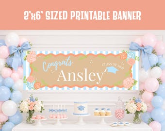 May include: A graduation banner reading "Congrats Ansley Class of 2026" in light blue and tan. The banner is 61cm x 183cm and is surrounded by balloons, flowers, and a table with a cake and cupcakes.