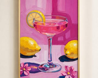 May include: Framed painting of a pink cocktail in a coupe glass with a lemon slice, two lemons, and pink flowers. The background is a blend of pink hues, and the frame is gold.