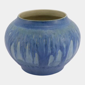 May include: A round ceramic vase with a wide opening and a tapered base. The exterior features a reactive glaze with shades of deep blue and lighter sky blue, creating a vertical drip pattern that transitions into a solid blue at the bottom.
