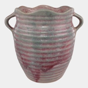 May include: A handmade ceramic vase with a wavy rim and two loop handles. The vase features horizontal stripes in shades of red and gray-green. The vase is approximately 6 inches tall.