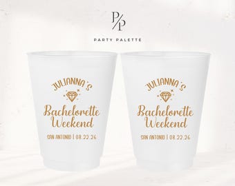 May include: Two white plastic cups with gold text and a diamond graphic. The text reads "Julianna's Bachelorette Weekend" and "San Antonio | 08.22.26".