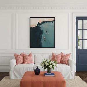 Small framed teal lake print above sofa, faded vintage finish bringing lake house decor charm