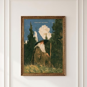 Könnte beinhalten: Ein gerahmter Kunstdruck mit einer bärtigen Figur in einem blauen spitzen Hut und braunem Umhang in einem Wald. Der Text STABLE? THAT'S FOR HORSES. steht oben mittig vor einem blauen Himmel mit einer weißen Wolke und grünen Bäumen.
