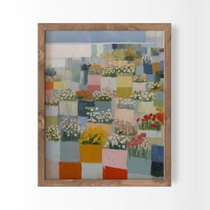Pode incluir: Uma impressão de arte de parede emoldurada apresentando uma composição em grade de blocos retangulares coloridos, cada um contendo arranjos florais estilizados em tons de amarelo, vermelho, branco e rosa, sobre um fundo azul e branco.