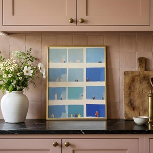 Kitchen counter styling, Tiny People Wall Art propped by vase, blue and cream geometric people grid, whimsical