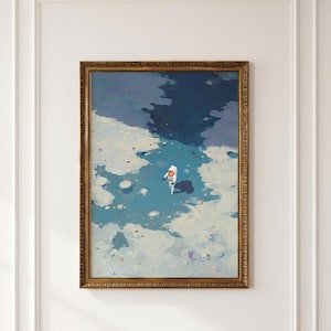 May include: A framed wall art print featuring a painting of a lone astronaut in a white suit walking across a textured, icy blue and white landscape. The scene depicts a vast, frozen terrain with deep blue shadows and scattered light-colored debris.