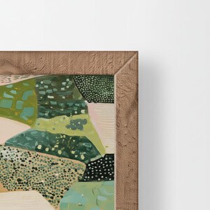 The image is a close-up of a framed painting with a vibrant, abstract landscape featuring various shades of green, yellow, and brown.