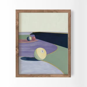 Puede incluir: Una lámina enmarcada con una ilustración estilizada de bolas de billar sobre una superficie abstracta multicolor. Una bola ocho de color crema se sitúa en primer plano, mientras que una bola azul y otra roja se encuentran en la distancia.