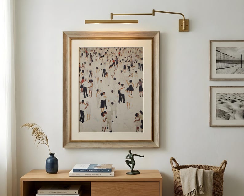 Gold frame above mid century modern sideboard, neutral abstract with playful tiny people dancing print, music lover wall art