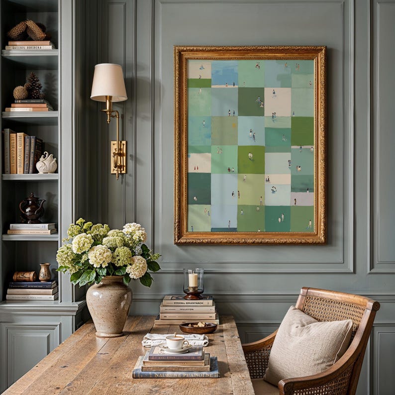 Framed sage checkerboard hung in a cozy study, desk and vase beside it, sage green printable wall art, playful gallery wall print