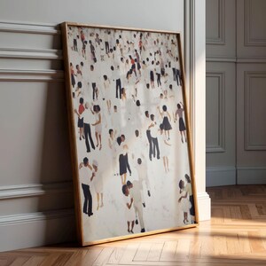 Large framed print leaning against paneled wall, warm light on neutral abstract tiny people dancing print, record shelf decor