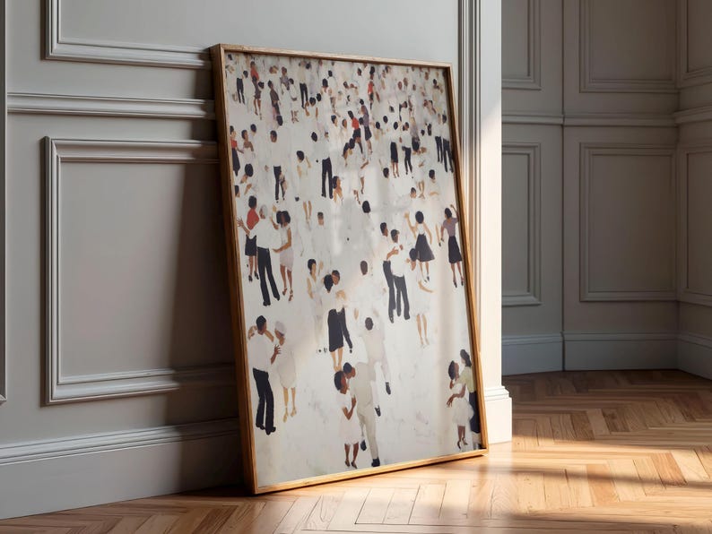 Large framed print leaning against paneled wall, warm light on neutral abstract tiny people dancing print, record shelf decor