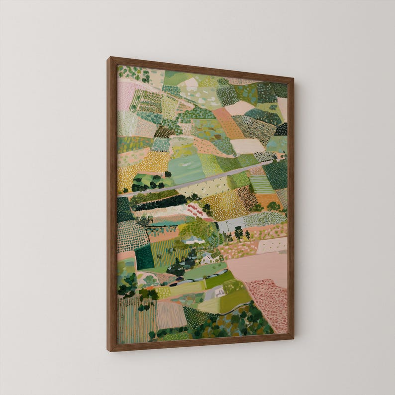 The image is a framed painting depicting a vibrant, colorful landscape with various elements such as trees, fields, and buildings.