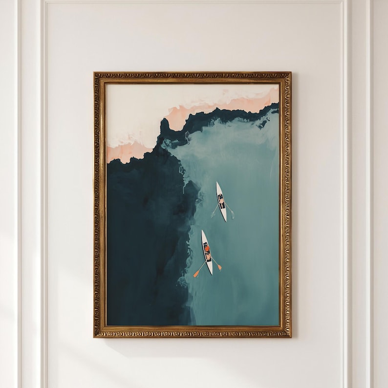 Gold-framed vintage lake print, aerial teal-blue water with tiny rowers, lake house wall art