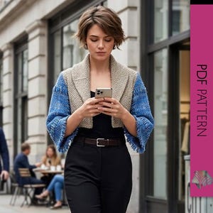May include: A cropped, two-tone jacket with blue sleeves and a tan body. The jacket is worn over a black top and paired with black pants. The image includes the text "PDF PATTERN" on a pink vertical banner.