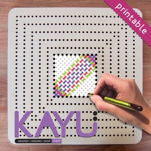 May include: A white pegboard with a colorful woven pattern in the center. The pegboard has a purple logo that says "KAYU" and the text "IMAGINED / DESIGNED / MADE CHILE".