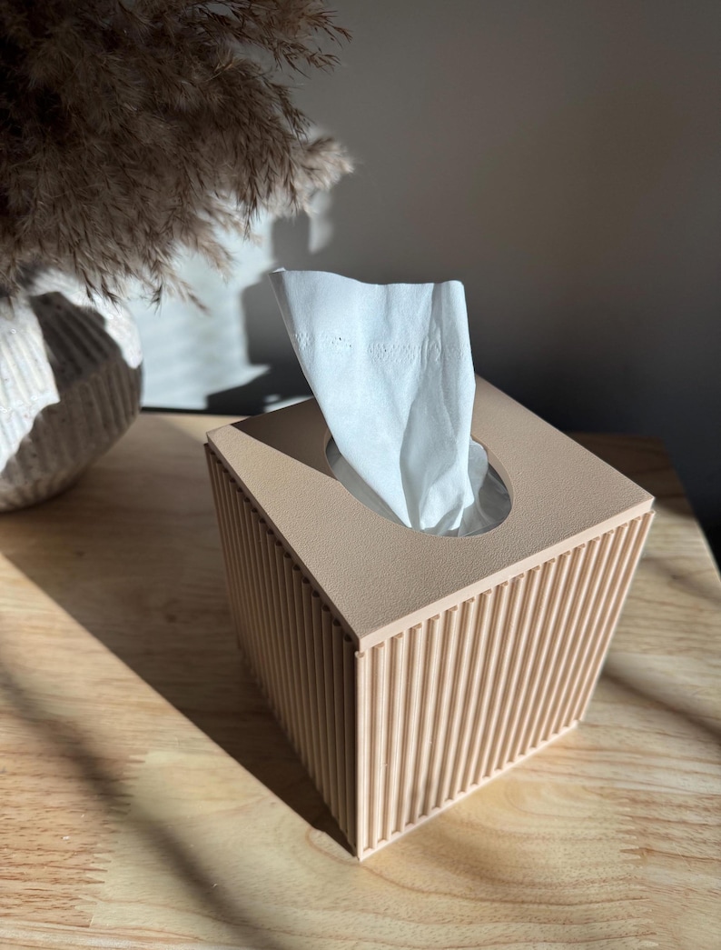 One beige ribbed tissue box cover