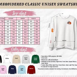 May include: White unisex sweatshirt with embroidered design. Features a size chart with measurements in inches and centimeters, and a color chart with various options. The sweatshirt has a ribbed neck, cuffs, and waistband. The text "EMBROIDERED CLASSIC UNISEX SWEATSHIRT" is at the top.