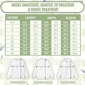 May include: A size chart for unisex sweatshirts, quarter-zip sweatshirts, and hoodies. The table lists US sizes from S to 5XL with corresponding length, width, and sleeve measurements in inches and centimeters, accompanied by three garment illustrations.