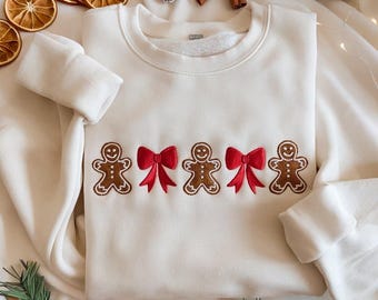 Bluza z haftem piernikowym, koszula świąteczna z piernikiem, okrągły dekolt z kokardą świąteczną, dziecięcy sweter świąteczny, minimalistyczna koszula świąteczna