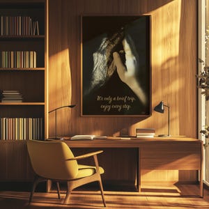 May include: A framed print with a black background featuring a close-up of a human hand and an animal paw touching. The text "It's only a brief trip, enjoy every step." is printed below the image.