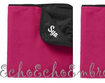 Outdoor Blanket.  Dark pink Fleece and Black water resistant side.  Embroidered with name  Picnic, sports game, beach  blanket