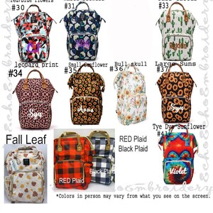May include: Ten different styles of diaper bags with various patterns and colors. The bags are all backpacks with a large main compartment and multiple pockets. The patterns include red and blue flowers, white flowers, tall cactus, leopard print, small sunflower, bull skull, large suns, fall leaf, red plaid, black plaid, and tie dye sunflower. The bags are all personalized with names.