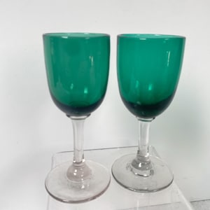 Two Victorian near match hand blown Bristol green wine glasses