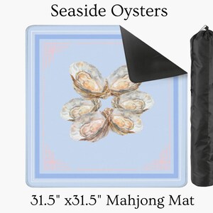 May include: A 31.5" x 31.5" Mahjong mat featuring a light blue background with a border and a central design of oysters. The mat has the text "Seaside Oysters" at the top. A black carrying bag is on the right.