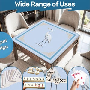 May include: A square wooden table with a light blue top featuring a white crane illustration. The table is surrounded by chairs and has the text "Wide Range of Uses" and "Elegant Design". The image also shows playing cards, dominoes, and mahjong tiles.