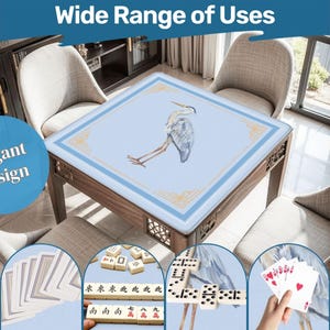 May include: A wooden table with a light blue surface featuring a heron illustration and gold trim. The table is surrounded by chairs. The image includes the text "Elegant Design" and "Wide Range of Uses". Additional images show playing cards, dominoes, and Mahjong tiles.