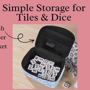 May include: Open black storage case with a mesh zipper pocket, filled with white tiles featuring red and black symbols. The case is open, revealing the contents, with additional tiles scattered nearby. Text reads: Simple Storage for Tiles & Dice.