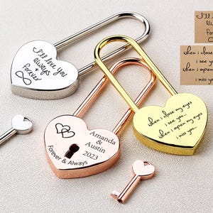 May include: Three heart-shaped padlocks with keys. The padlocks are gold, silver, and rose gold. The gold padlock has the inscription "when I close my eyes I see you... when I open my eyes I miss you..." The silver padlock has the inscription "I'll love you always forever ∞". The rose gold padlock has the inscription "Amanda & Austin 2023 Forever & Always".