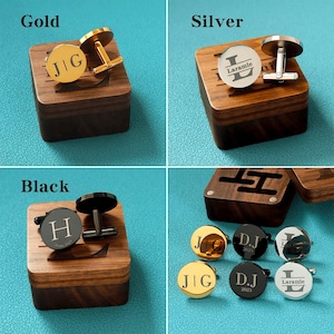 May include: Set of cufflinks in gold, silver, and black with engraved initials and dates. The cufflinks are displayed in wooden boxes.