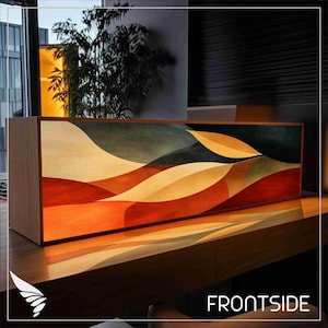 May include: A rectangular wooden lamp with a colorful abstract landscape design. The artwork features flowing shapes in shades of red, orange, yellow, and green. The word "FRONTSIDE" is printed in white on the bottom right.