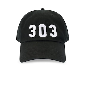 May include: Black baseball cap with the white number "303" embroidered on the front. The cap has a curved brim and a small button on top. The background is plain white.